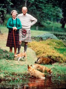 Queen of England with husband and dogs