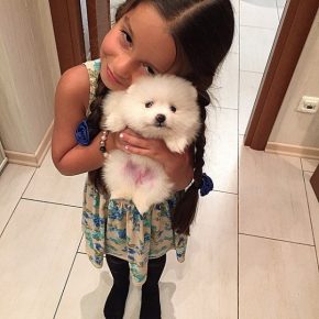 The daughter of Ksenia Borodina with a dog