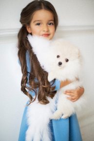 The daughter of Ksenia Borodina with the dog Winter