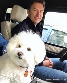 Syutkin in a car with a dog