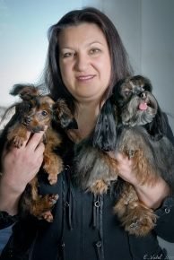 Nina Nasibova with two dogs in her arms